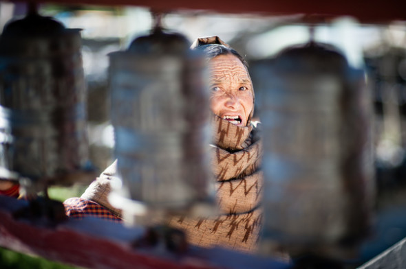 nepali woman prayer wheel